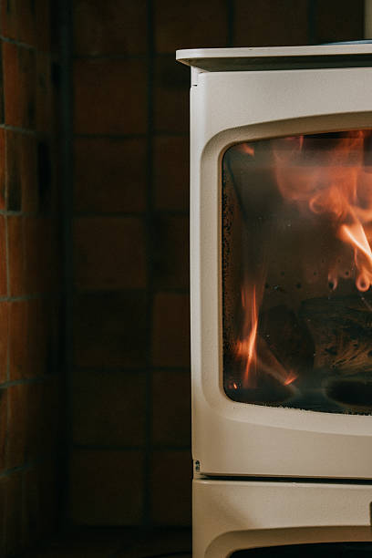 istock A white stove with a brick wall behind it 2210262005