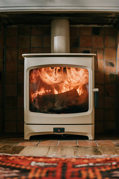 istock A white stove with a fire burning in it 2210263026