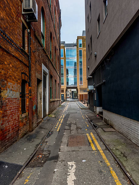 istock A narrow alleyway with a brick building on one side 2210264469