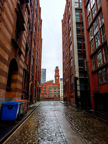 istock A narrow alleyway with a clock tower in the background 2210265087