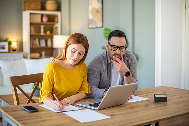 istock Couple discussing home finances 2210265452