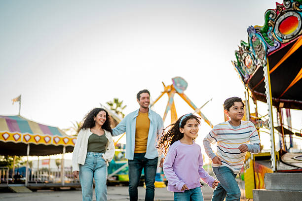 istock Child siblings running on amusement park 2210265466