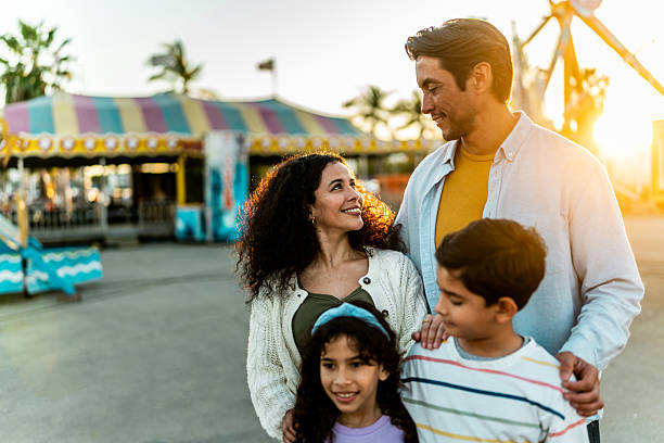 istock Family talking at amusement park 2210265475