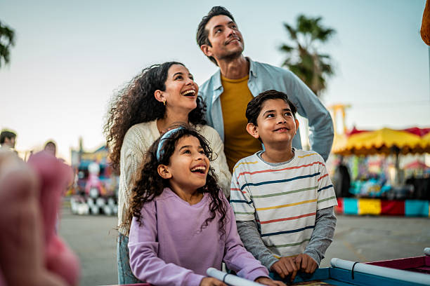 istock Family playing game on carnival booth 2210265491
