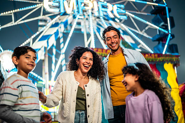 istock Family talking at amusement park 2210265511
