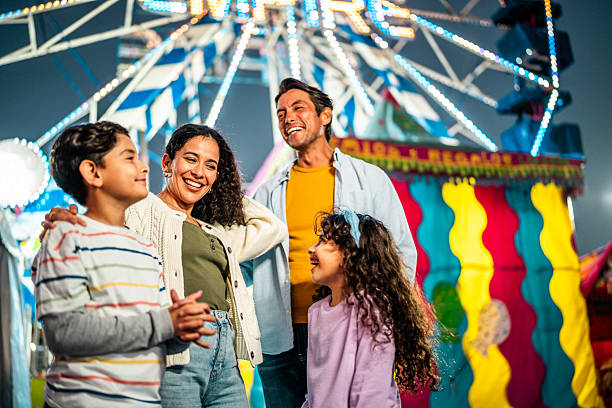 istock Family talking at amusement park 2210265512