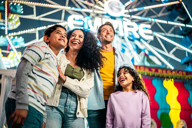 istock Family talking at amusement park 2210265513