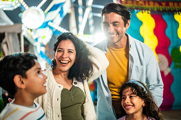 istock Family talking at amusement park 2210265515