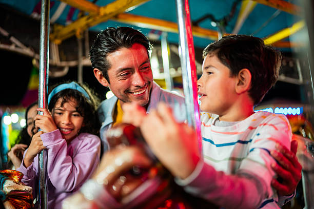 Christmas fair, traditional fair carousel with lights blurred background