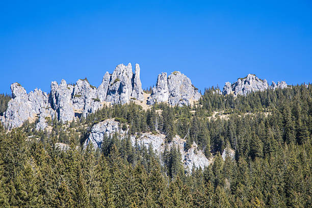 istock Stone mountain peaks against the blue sky 2210266676