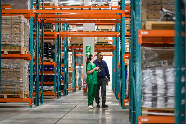 istock Manager and staff inspecting warehouse inventory in a medical storage facility 2210267172