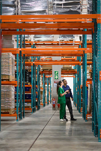 istock Warehouse workers checking inventory in a brightly lit medical storage facility 2210267197