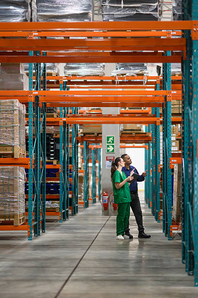istock Manager and staff checking inventory in a medical warehouse 2210267206