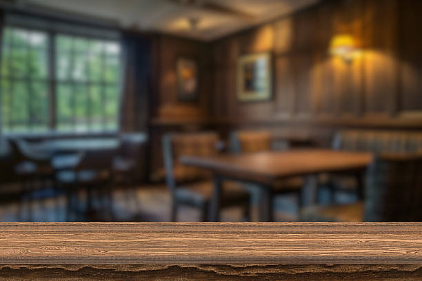 istock Empty wooden table top with lights bokeh on blur restaurant background. 2210267723