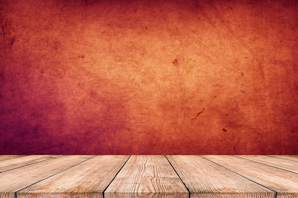istock Background with wooden deck and red grunge wall 2210267733