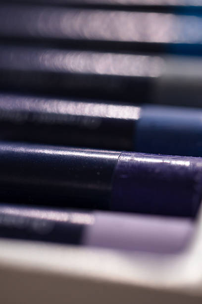 Close-up of a colorful collection of oil pastel crayons with a blurred artistic background. Perfect representation of focus and creative workspace mood.