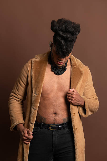 istock Stylish model opening fur coat and showing abs 2210269483