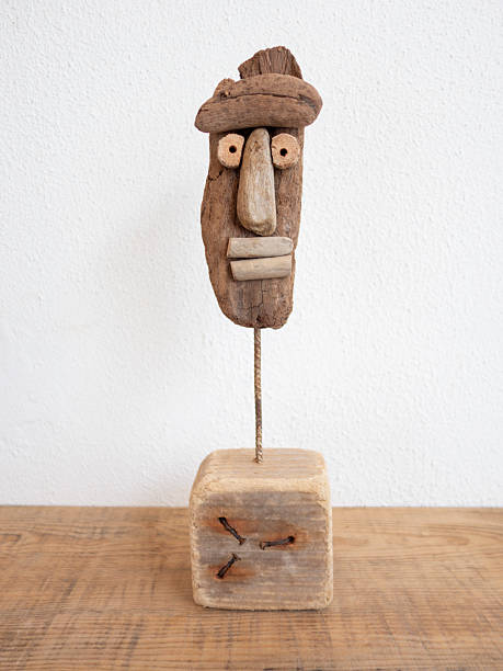 Wooden sculptures. Crafted from driftwood. Handmade. White wall background. Design and production are my own.