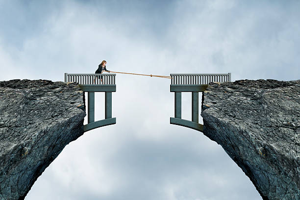 istock Woman Using Rope To Bridge The Gap 2210270795
