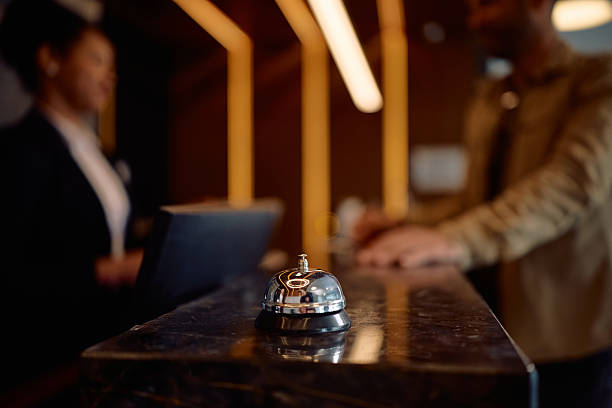 istock Close up of service bell at hotel reception. 2210276723