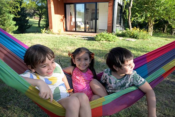 group of children in the field in a hammock