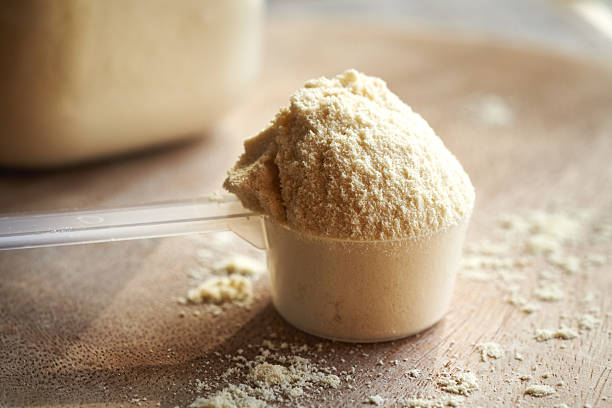 istock Whey protein powder in a plastic measuring spoon 2210277449