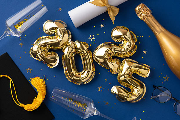 istock Golden 2025 balloons surrounded by graduation and celebration themed objects on a blue background 2210278866