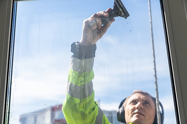 istock A Dedicated Window Cleaner Hard at Work, Ensuring Crystal Clear Views with Safety Gear, Preparing for a Bright and Clear Day in the Sunshine While Cleaning Glass Windows Professionally 2210289847