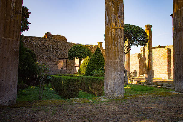 Pompeii cobblestone street illuminated backlit at sunset