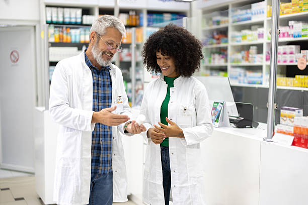 istock Colleagues pharmacists consulting and cooperating 2210299895