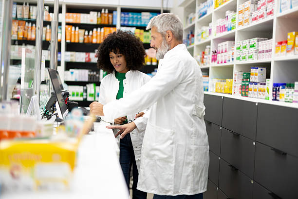 istock Two pharmacists planning the work of their pharmacy 2210299958