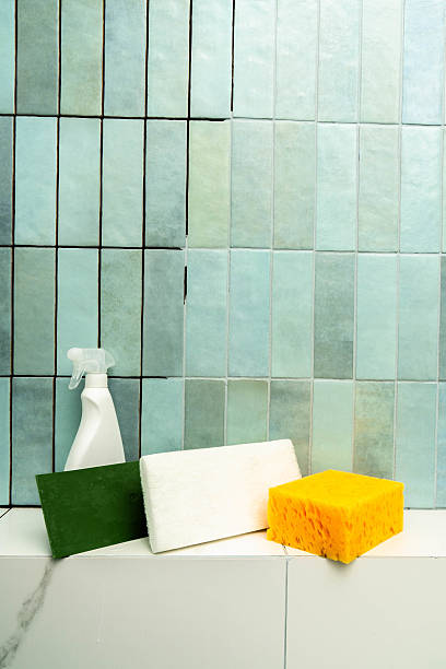 istock Repairing tiled surfaces with epoxy grout and adhesive in a bathroom setting 2210300014