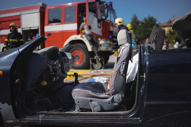 Shot of rescue team saving people from car accident .