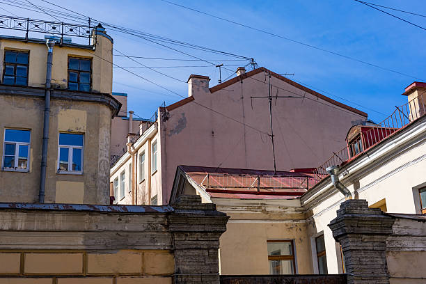 Buildings with windows and a clear blue sky.