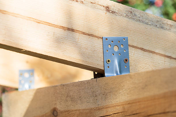 istock A wooden beam with a metal bracket on it 2210309093