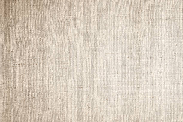 istock Brown sackcloth woven texture background in natural pattern. Jute hessian burlap, linen background in light beige cream color blank. Weaving canvas fiber line cotton cloth textured as organic. 2210309661