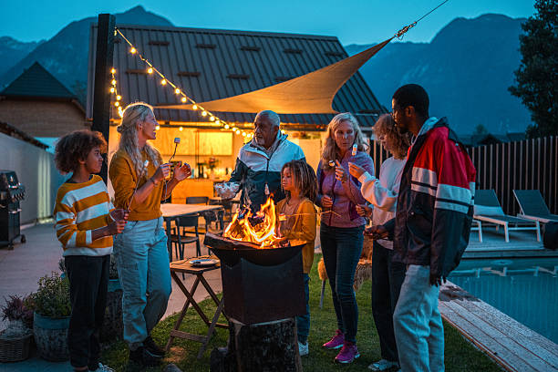 istock Multigenerational Family Enjoying Evening by Fire Pit 2210313350