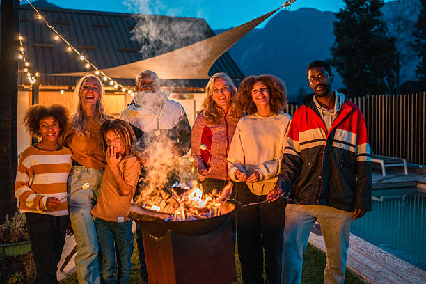 istock Diverse Family Enjoying Outdoor Marshmallow Roast 2210313355