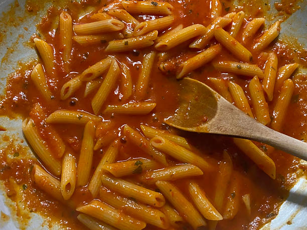 Cooking Pasta Arrabiata stock photo