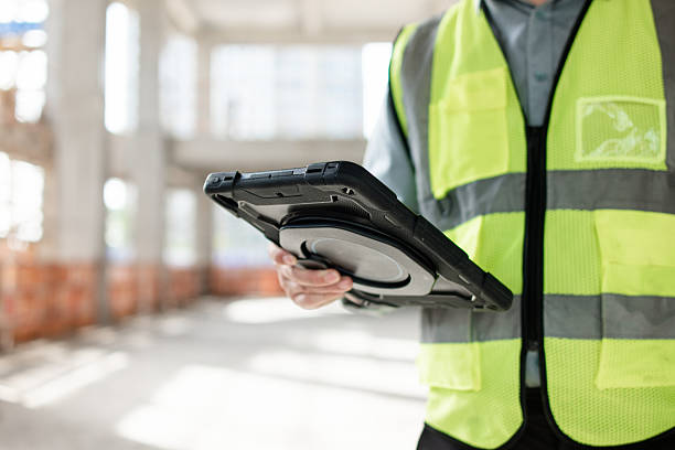 istock asian male engineer working on digital tablet in construction site 2210314310