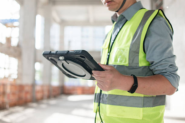 istock asian male engineer working on digital tablet in construction site 2210314407