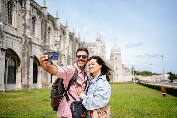 istock Beautiful tourist couple taking selfie 2210314656