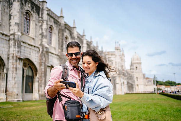 istock Beautiful tourist couple checking their phone 2210314657