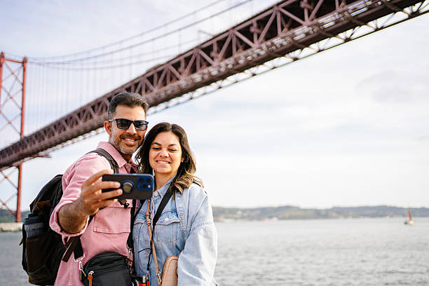 istock Beautiful tourist couple taking selfie 2210314730