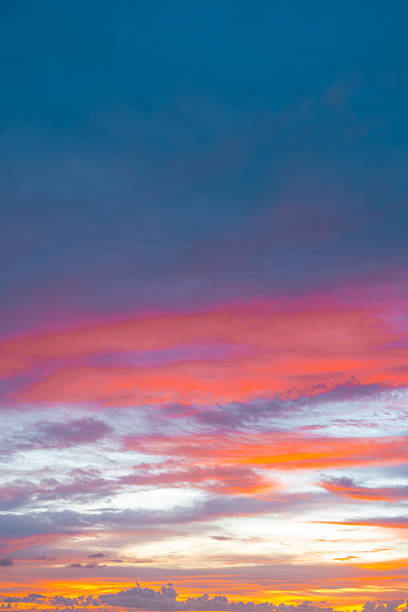 istock Twilight bathed in orange and red tones, with beautiful clouds glowing during sunset. 2210322829