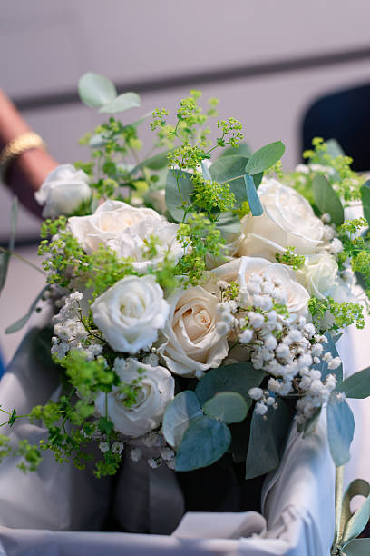 istock Beautiful white rose bouquet with greenery accents 2210324594