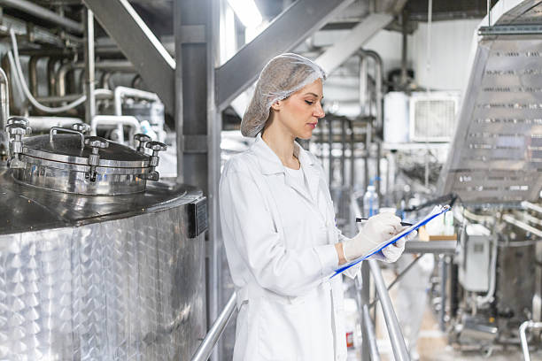 istock Working with industry machinery at a dairy factory 2210327843