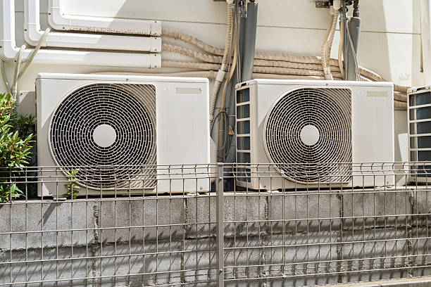 istock Two Outdoor Air Conditioning Units 2210332622