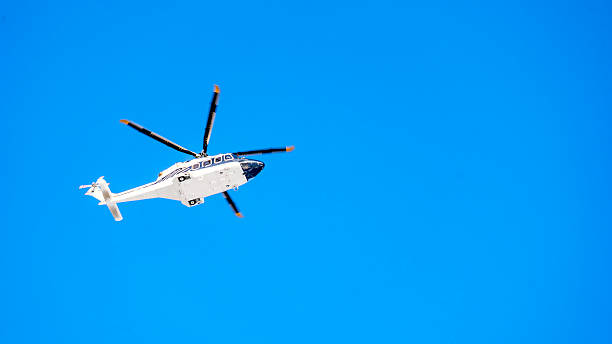 istock A helicopter is flying in the sky 2210334043