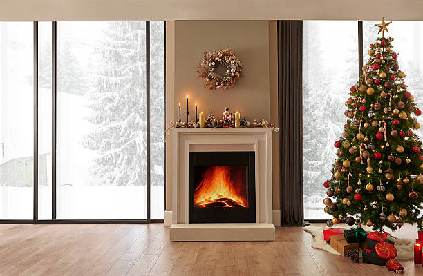 istock Christmas tree, ornaments, fireplace and interior room style, brick wall background, snowy forest view. 2210336409